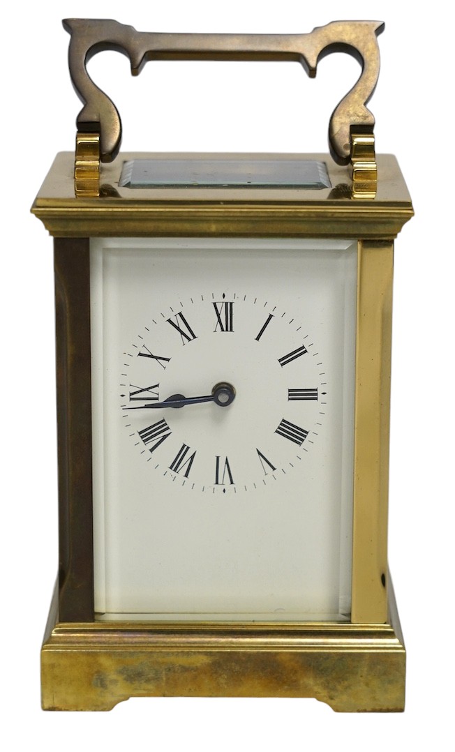 A carriage timepiece with white enamelled Roman dial, in a gilt brass and glazed case, 13cm. Condition - fair to good, not tested as working